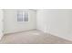 Bedroom features a window and neutral carpet at 28610 E 8Th Pl, Watkins, CO 80137