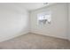 Bedroom with window and neutral carpet at 28610 E 8Th Pl, Watkins, CO 80137