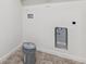 A utility area includes a bucket, hookups, and tile flooring at 28610 E 8Th Pl, Watkins, CO 80137