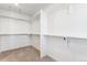 A walk-in closet with carpet and shelving for storage at 28610 E 8Th Pl, Watkins, CO 80137