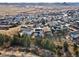 Stunning aerial view showcasing a Gathering-friendly neighborhood, mountain views and lush green landscape at 3131 Keepsake Way, Castle Rock, CO 80109