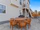 Backyard patio with outdoor seating, dining area and a view of the home's exterior at 3131 Keepsake Way, Castle Rock, CO 80109