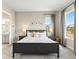 Comfortable main bedroom suite with natural light and en-suite bathroom offers a relaxing retreat at 3131 Keepsake Way, Castle Rock, CO 80109
