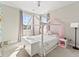 Cozy bedroom with a decorative bedframe, plush cushions, and bright natural light at 3131 Keepsake Way, Castle Rock, CO 80109