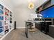 Well-lit home office with custom built-ins, floating desk, and unique light fixtures create a modern workspace at 3131 Keepsake Way, Castle Rock, CO 80109