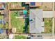 Bird's eye view of the property with a well-maintained lawn, shed, and outdoor seating area at 2544 S Raleigh St, Denver, CO 80219