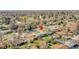 Aerial view of the property with a well-maintained lawn and mature trees in a quiet neighborhood at 2544 S Raleigh St, Denver, CO 80219