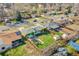 An aerial view of the property showcases the house, yard, and surrounding neighborhood at 2544 S Raleigh St, Denver, CO 80219