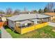 Cozy backyard featuring a lounge area with stylish outdoor seating and privacy fencing at 2544 S Raleigh St, Denver, CO 80219