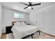 Inviting bedroom featuring hardwood floors, natural light, and simple, clean design at 2544 S Raleigh St, Denver, CO 80219