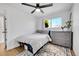 Relaxing bedroom with hardwood floors, lots of natural light, and neutral-colored decor at 2544 S Raleigh St, Denver, CO 80219