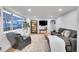 Bright living room features a large window, modern furniture, and stylish decor at 2544 S Raleigh St, Denver, CO 80219