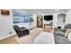 Bright living room features a large window, modern furniture, and stylish decor at 2544 S Raleigh St, Denver, CO 80219