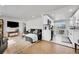 Bright, open-concept living room with a view to the well-appointed kitchen and modern appliances at 2544 S Raleigh St, Denver, CO 80219
