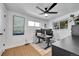 Bright office space with hardwood floors, multiple monitors, and a modern desk setup at 2544 S Raleigh St, Denver, CO 80219