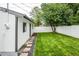 Lush backyard with a well-maintained lawn and privacy fence, offering a serene outdoor space at 320 S Jersey St, Denver, CO 80224