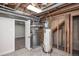 Basement mechanicals featuring furnace and hot water heater at 320 S Jersey St, Denver, CO 80224