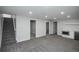Spacious finished basement with neutral carpet, and kitchenette area at 320 S Jersey St, Denver, CO 80224