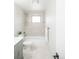 Bathroom showing shower, bath, white tiling, and modern fixtures at 320 S Jersey St, Denver, CO 80224