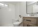 Stylish bathroom featuring modern fixtures, tiled walls, and a comfortable bench at 320 S Jersey St, Denver, CO 80224