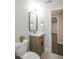 Modern bathroom with stylish vanity, framed mirror, and decorative tile flooring, creating a chic space at 320 S Jersey St, Denver, CO 80224