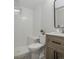 Stylish bathroom featuring modern fixtures, tiled walls, and a comfortable bench at 320 S Jersey St, Denver, CO 80224