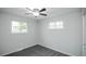 Well lit bedroom features carpet, ceiling fan, and two large windows at 320 S Jersey St, Denver, CO 80224