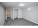 Cozy bedroom with plush carpet, sliding closet doors, and ample natural light from the window at 320 S Jersey St, Denver, CO 80224