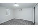 Bright and simple bedroom featuring carpet, a window, and neutral walls at 320 S Jersey St, Denver, CO 80224