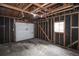Spacious garage with exposed wood rafters and ready for your vehicles or storage needs at 320 S Jersey St, Denver, CO 80224