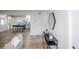 Open-concept living area flows into the kitchen with hardwood floors and modern decor, with access to other rooms at 320 S Jersey St, Denver, CO 80224