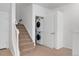 Hallway with a staircase and convenient in-unit washer and dryer at 5255 Memphis St # 219, Denver, CO 80239
