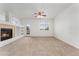 Spacious living room featuring a cozy fireplace and access to the outdoor patio at 5255 Memphis St # 219, Denver, CO 80239