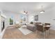 Cozy living room featuring neutral tones, a fireplace, and bright natural lighting at 5255 Memphis St # 219, Denver, CO 80239
