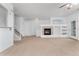 Bright living room boasts a fireplace and easy access to the staircase and patio at 5255 Memphis St # 219, Denver, CO 80239