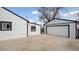Spacious backyard featuring a detached garage and additional storage at 766 Fulton Ave, Brighton, CO 80601
