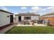 Backyard patio features outdoor seating, BBQ grill, and a relaxing hot tub at 766 Fulton Ave, Brighton, CO 80601