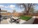 Backyard features a grill, a hot tub, and a patio table set at 766 Fulton Ave, Brighton, CO 80601