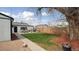 Backyard featuring a patio dining set, hot tub, grill, and expansive yard at 766 Fulton Ave, Brighton, CO 80601