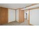 Finished basement featuring paneled walls and carpeting, showcasing the room's potential at 766 Fulton Ave, Brighton, CO 80601