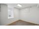 Finished basement room featuring neutral carpeting, a small basement window, and neutral walls at 766 Fulton Ave, Brighton, CO 80601