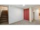 Basement featuring a staircase, large closet, and entryway, offering flexible space at 766 Fulton Ave, Brighton, CO 80601