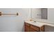 Well-lit bathroom featuring a vanity with a sink and a large framed mirror at 766 Fulton Ave, Brighton, CO 80601