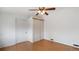 Bedroom featuring wood-look floors, white walls, and a double closet at 766 Fulton Ave, Brighton, CO 80601