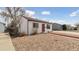 Charming one-story home featuring a red front door and low maintenance landscaping at 766 Fulton Ave, Brighton, CO 80601