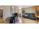 Inviting living room with sleek hardwood floors, a large sofa, and contemporary decor at 766 Fulton Ave, Brighton, CO 80601