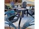 Unique backyard with modern fire pit, surrounded by Adirondack chairs and a decorative metal bird statue at 12292 W 65Th Ave, Arvada, CO 80004