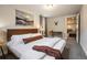 Relaxing bedroom with a king bed, modern lighting, and a connecting sitting area at 12292 W 65Th Ave, Arvada, CO 80004