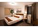 Inviting bedroom with a king bed, wood floors, and natural light from the window at 12292 W 65Th Ave, Arvada, CO 80004