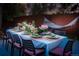 Elegant outdoor dining table beautifully decorated with flowers, linens and set for a dinner party at 12292 W 65Th Ave, Arvada, CO 80004